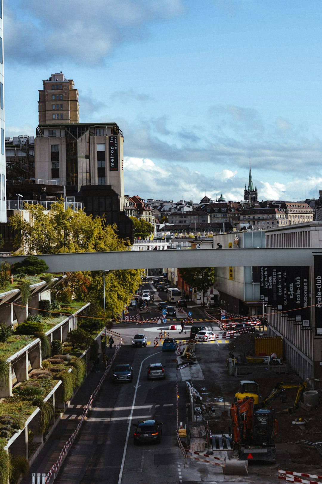 a-city-street-filled-with-lots-of-traffic-next-to-tall-buildings-jw3hb-kif-4