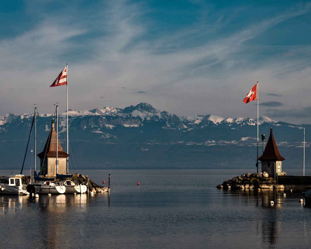 brown-and-white-boat-on-water-near-brown-wooden-dock-during-daytime-vkf-olpbk6i