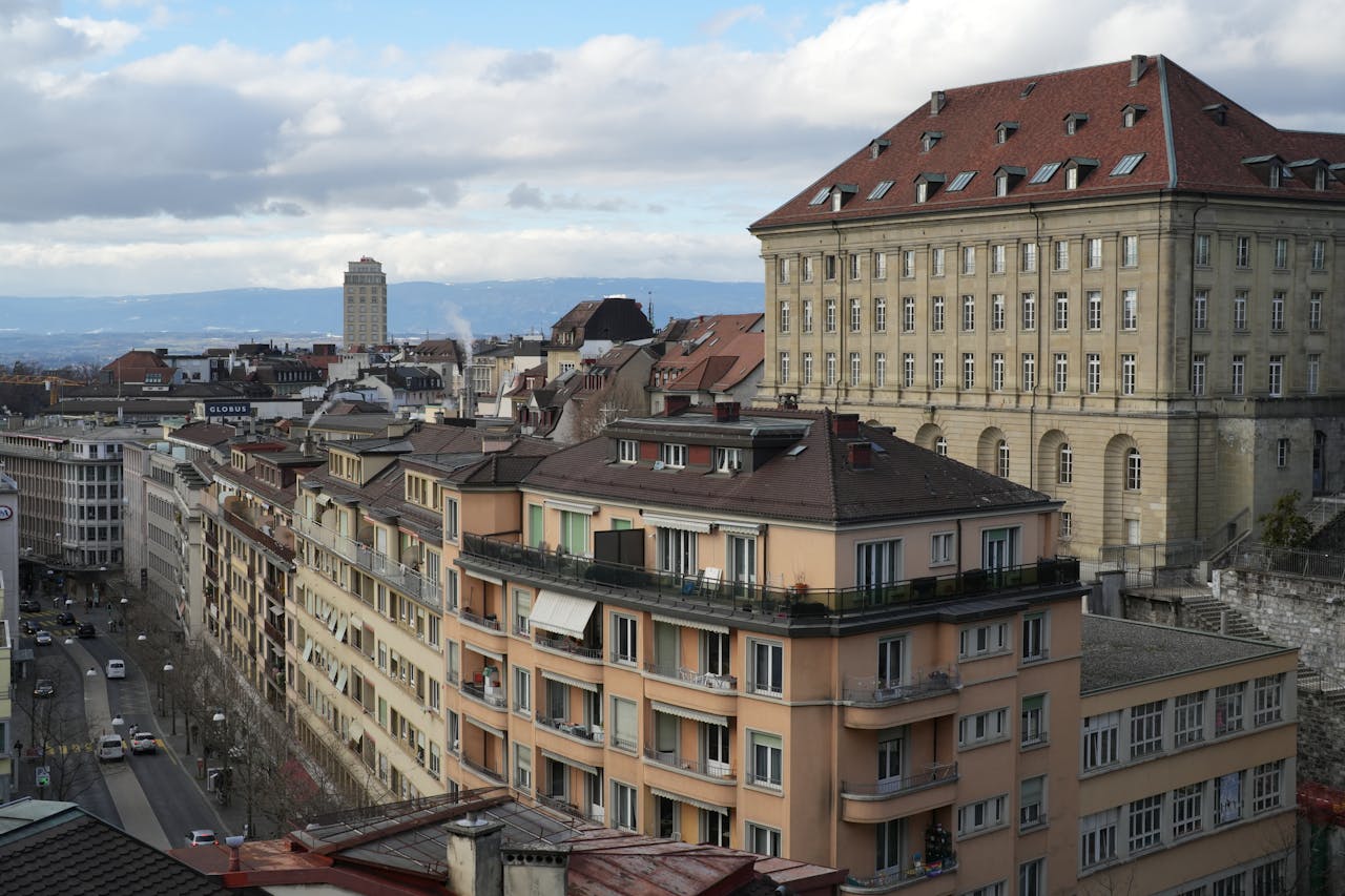 Panoramic view of Lausannes historic architecture with rooftops and a clear sky.